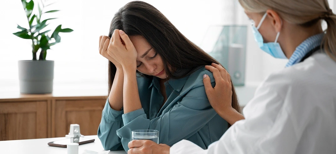 Psychiatrist consulting patient in office